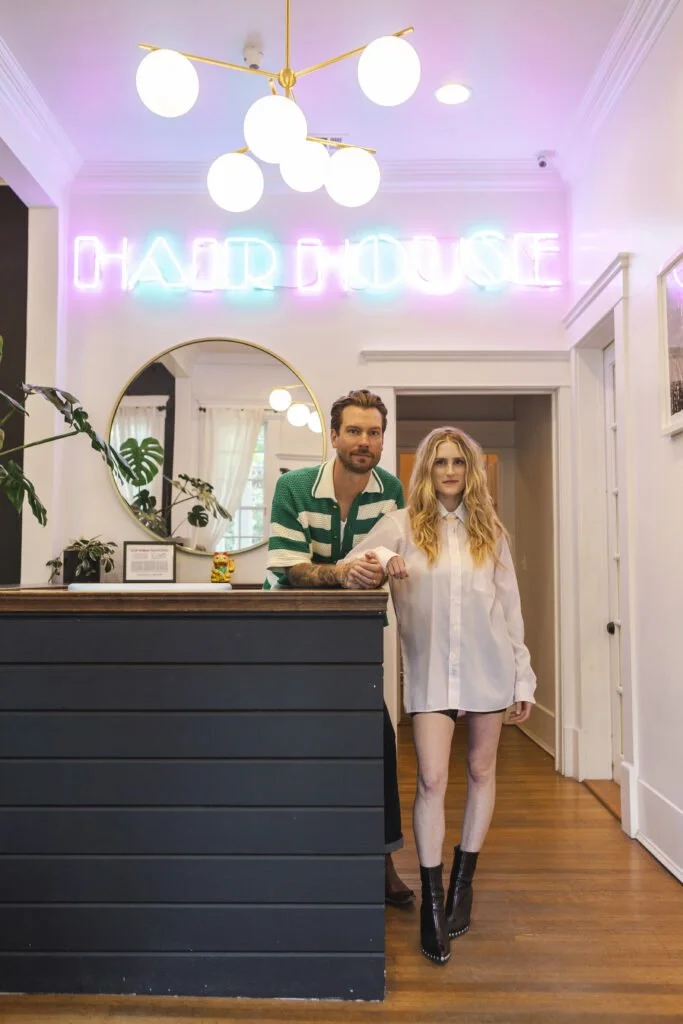 Hair House ATX front desk with neon sign